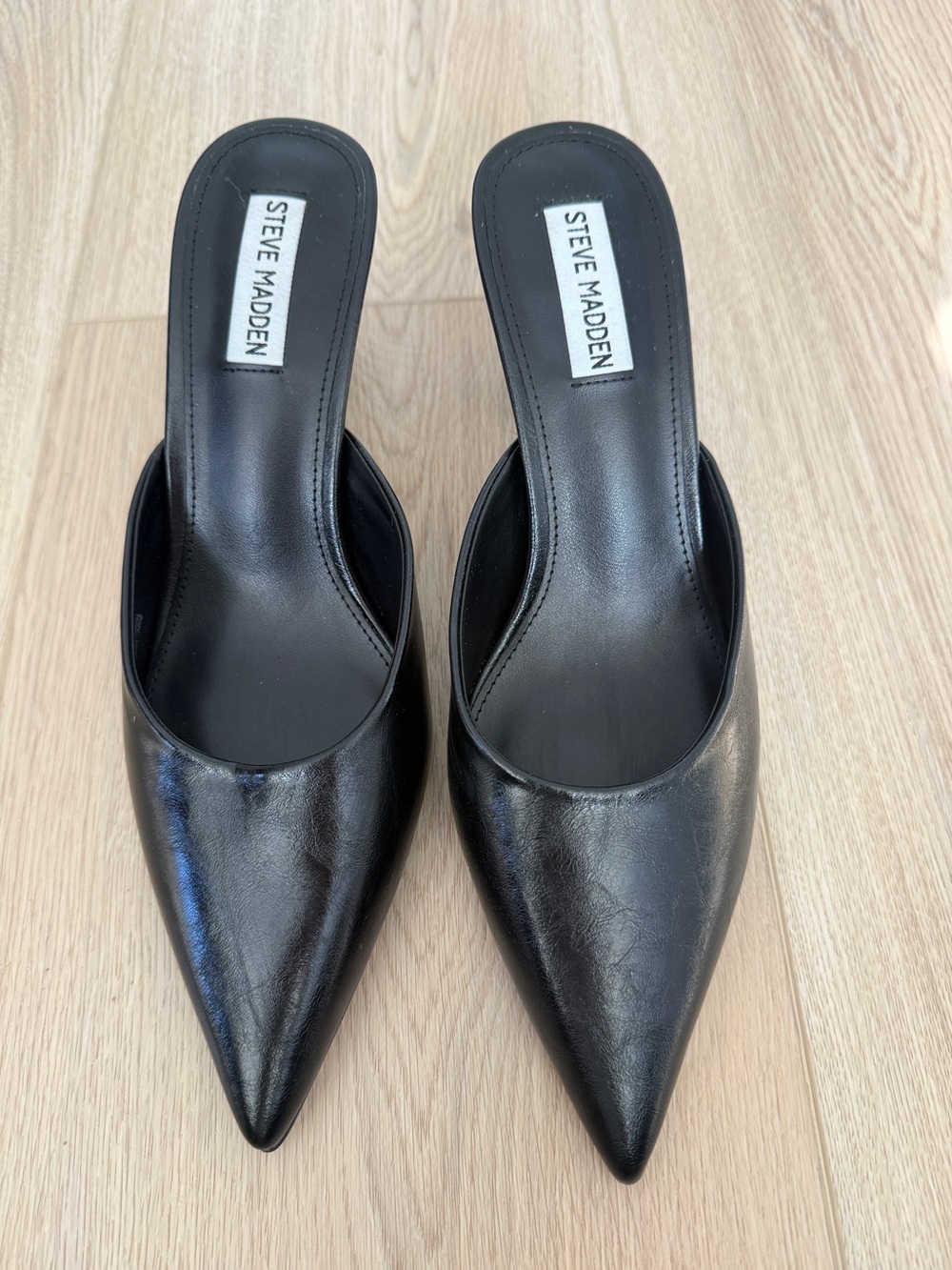 Steve Madden "Emmie" black pointed-toe block-heel mules, women's size
9.5 M.